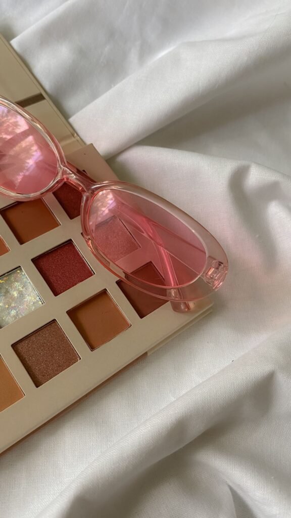 Eyeshadow palette with pink sunglasses